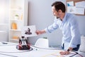 Man holding a picture of his invention Royalty Free Stock Photo