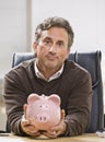 Man Holding Piggy Bank Royalty Free Stock Photo