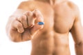 Man holding a pill used for Pre-Exposure Prophylaxis PrEP Royalty Free Stock Photo