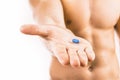 Man holding a pill used for Pre-Exposure Prophylaxis Royalty Free Stock Photo