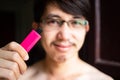 Man holding pink USB memory stick Royalty Free Stock Photo