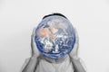 A man holding planet earth instead of head. Element of this image are furnished by NASA Royalty Free Stock Photo