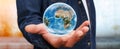 Man holding the planet earth in his hand Royalty Free Stock Photo
