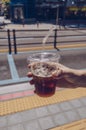 Man holding plastic mug of iced convinience store coffee Royalty Free Stock Photo