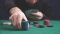 Man holding poker chips. Casino