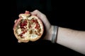 Man holding a pommegranate Royalty Free Stock Photo
