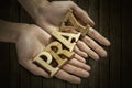 Man holding pray word in palm