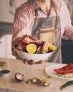 Man holding prepared meat for roasting