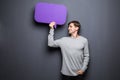 Man holding purple blank speech bubble with space for text Royalty Free Stock Photo