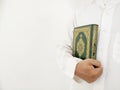 Man Holding and reading quran. Islamic Background