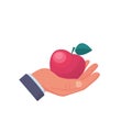 Man holding a red apple in hand. Healthy and wholesome fruit concept