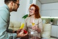 Man holding red box with marriage engagement ring and make proposal to happy girlfriend