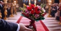 Man holding red rose flower on wedding day