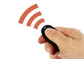 Man holding remote sensor in hand sending signal