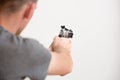 Man holding a revolver in hands ready to shoot. Royalty Free Stock Photo