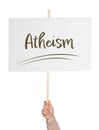 Man holding sign with word Atheism on white background, closeup