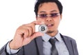 Man holding silver bitcoin in hand isolated on white background Royalty Free Stock Photo