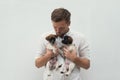 Man holding two small puppies in his hands Royalty Free Stock Photo