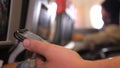 Close up of man holding smartphone during flight trip. Traveller sit down inside the plane using phone device Royalty Free Stock Photo