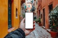 Man holding smartphone showing white blank screen