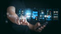 Man holding smartphone and touching virtual mobile app interface. UI UX design, software development, and digital data analysis Royalty Free Stock Photo