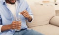 Man holding soluble white pill and a glass of water Royalty Free Stock Photo