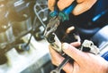 Man holding spark plug in old car engine. Inner details of machine. Repairing of vehicle Royalty Free Stock Photo