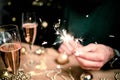 man holding sparkles and champagne glass New Year party Royalty Free Stock Photo