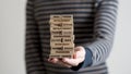 Man holding stack of wooden bricks