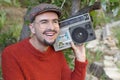 Man holding stereo boombox in the 1980s