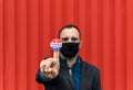 Man holding a sticker with the American flag colors with 'I voted today' written on it Royalty Free Stock Photo