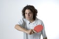 Man Holding a Table Tennis Paddle - Horizontal Royalty Free Stock Photo