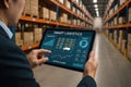 Man holding tablet displaying smart logistics dashboard in warehouse technology inventory Royalty Free Stock Photo