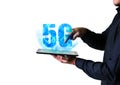 Man is holding tablet with 5G sign. New internet concept. Covering connection all over the world. Dangerous technologies. Modern Royalty Free Stock Photo