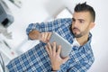 Man holding tablet pc to find problem