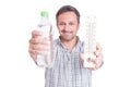 Man holding thermometer and cold water bottle Royalty Free Stock Photo