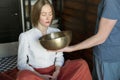 Man holding tibetan singing bowls in sound therapy in spa center Royalty Free Stock Photo