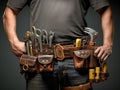 Man holding a tool belt with many tools on it