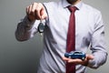 A man holding a toy car and keys in his hands Royalty Free Stock Photo