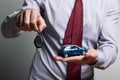 A man holding a toy car and keys in his hands Royalty Free Stock Photo