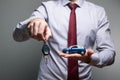 A man holding a toy car and keys in his hands Royalty Free Stock Photo