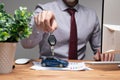 A man holding a toy car and keys in his hands Royalty Free Stock Photo