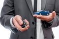 Man holding toy car and keys isolated on white Royalty Free Stock Photo