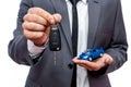 Man holding toy car and keys  on white Royalty Free Stock Photo