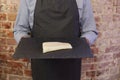 Man holding tray with cod fillet on Royalty Free Stock Photo