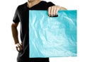 A man holding a turquoise plastic bag. Close up. Isolated on white background