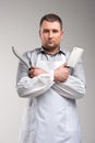 man holding two butcher knives