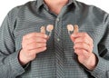 Man holding two hearing aids Royalty Free Stock Photo