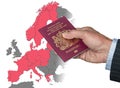 Man holding UK passport on map of EU Schengen Zone Royalty Free Stock Photo