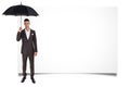 Man holding umbrella and blank board Royalty Free Stock Photo